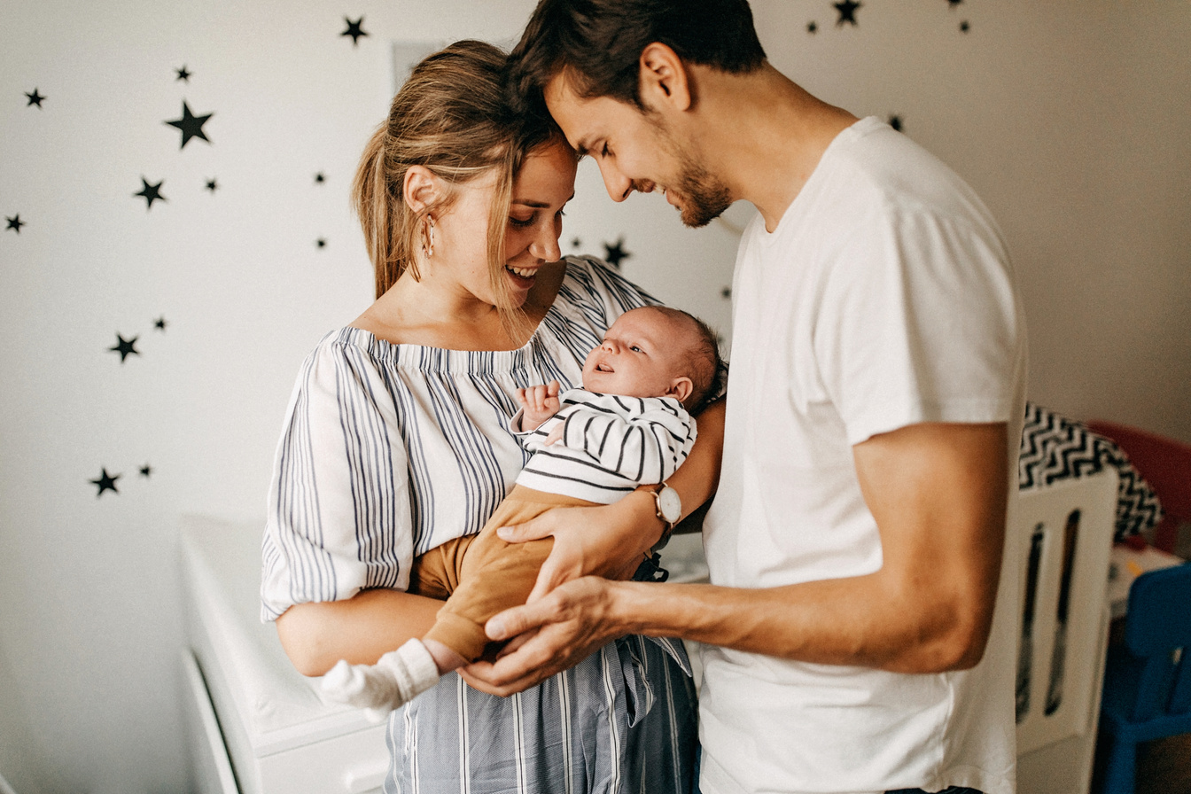 Parents holding their baby